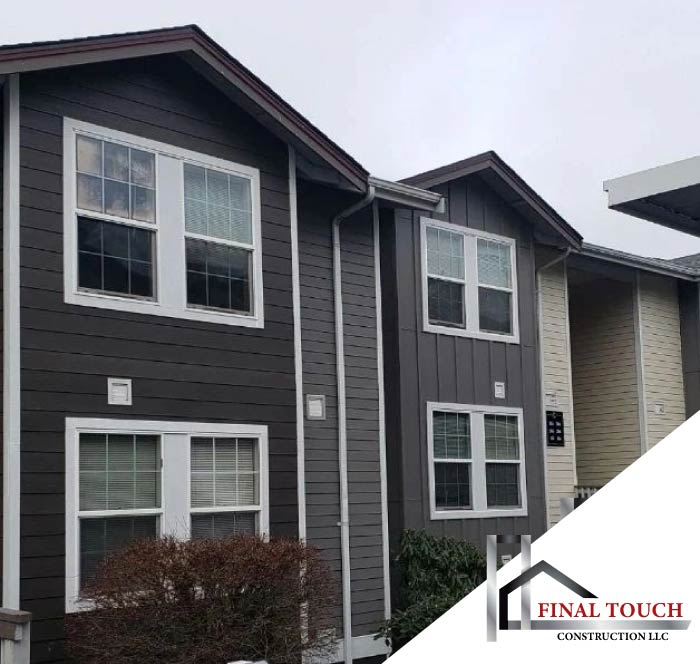 Completed multi-family housing complex featuring expert horizontal and vertical siding installation by Final Touch Construction, the premier general contractor for large-scale projects.