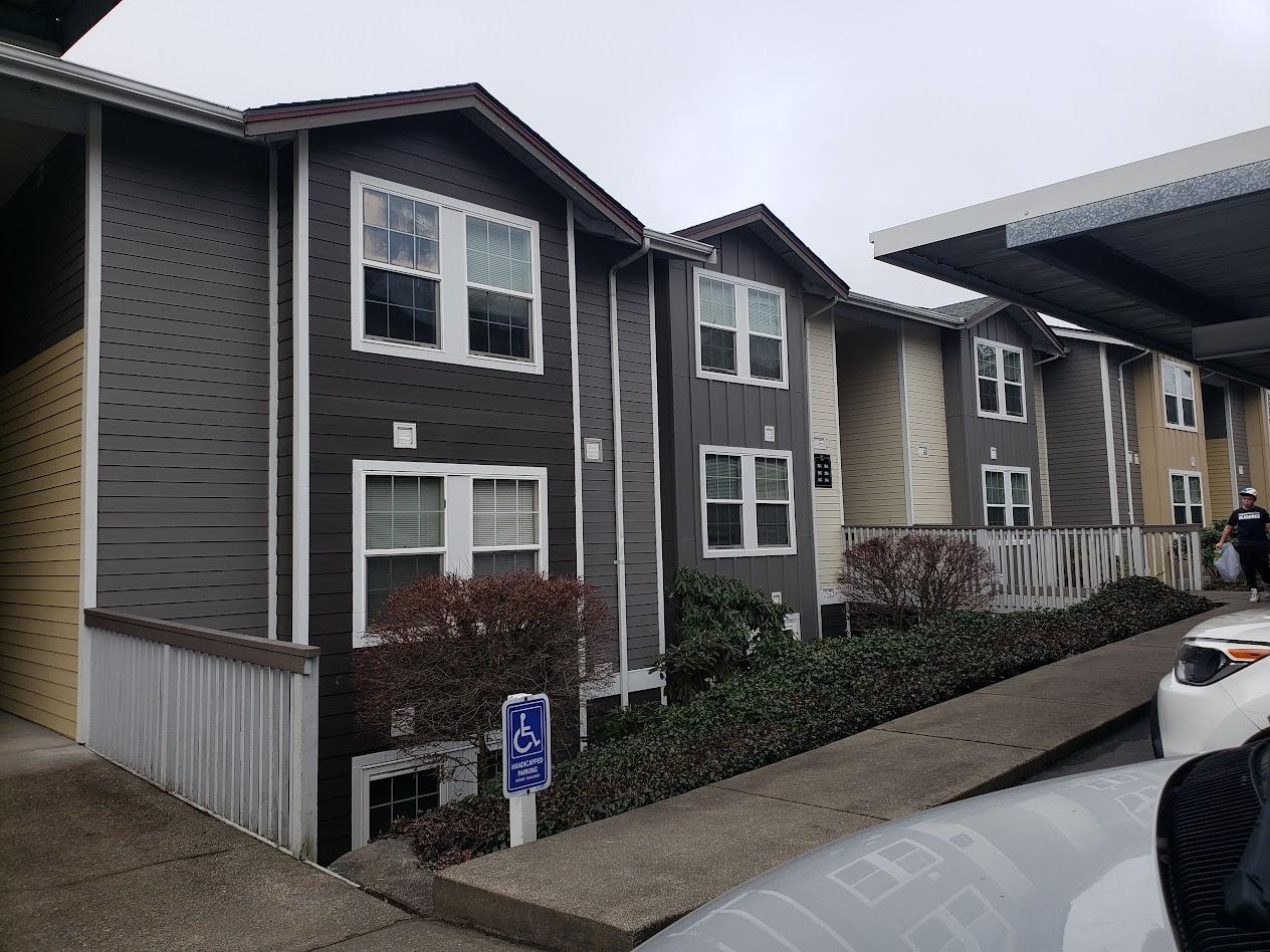 Large-scale exterior renovation of a historic multi-family residence in Seattle, managed by general contractor Final Touch Construction to improve structural integrity and curb appeal.