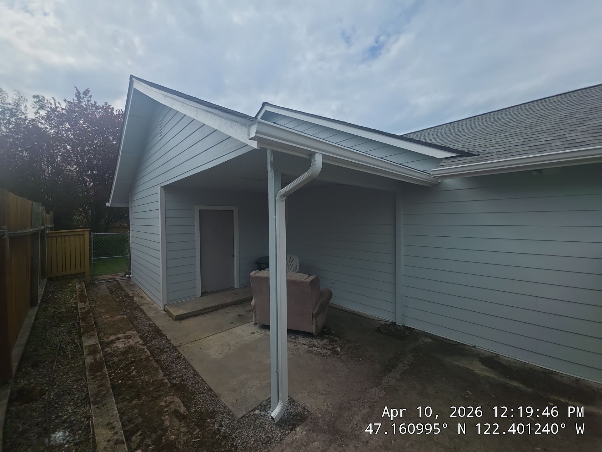 Close-up of a professionally installed K-style gutter system and downspout on a residential home, integrated with premium fiber cement siding, after gutter installation in tacoma