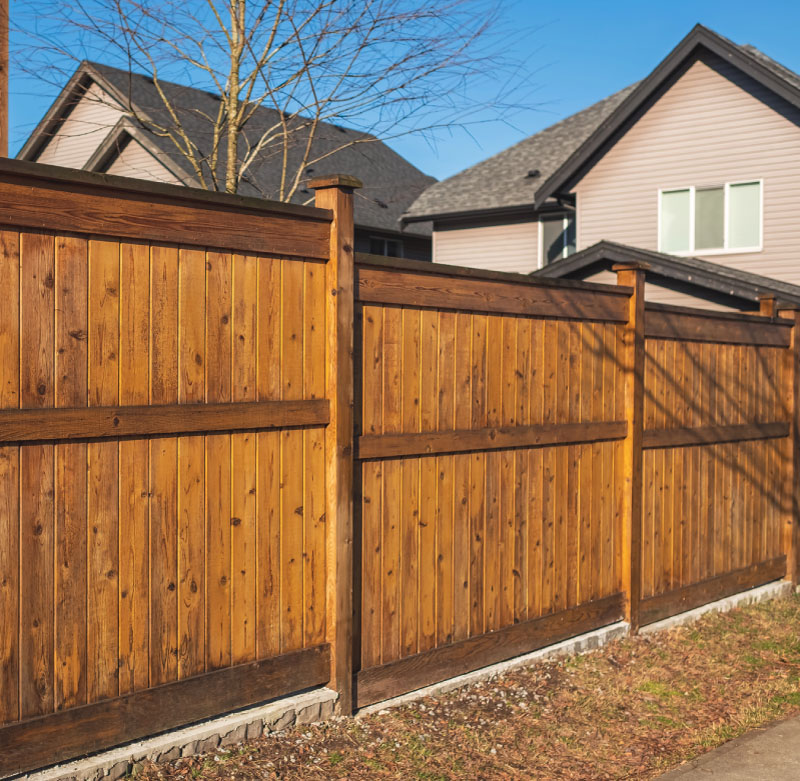 Cedar privacy fence installation in a residential backyard, built by Final Touch's fence contractors in Tacoma WA